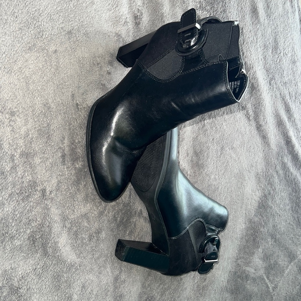 Black booties only worn once. Heel size is 3.5 inches
